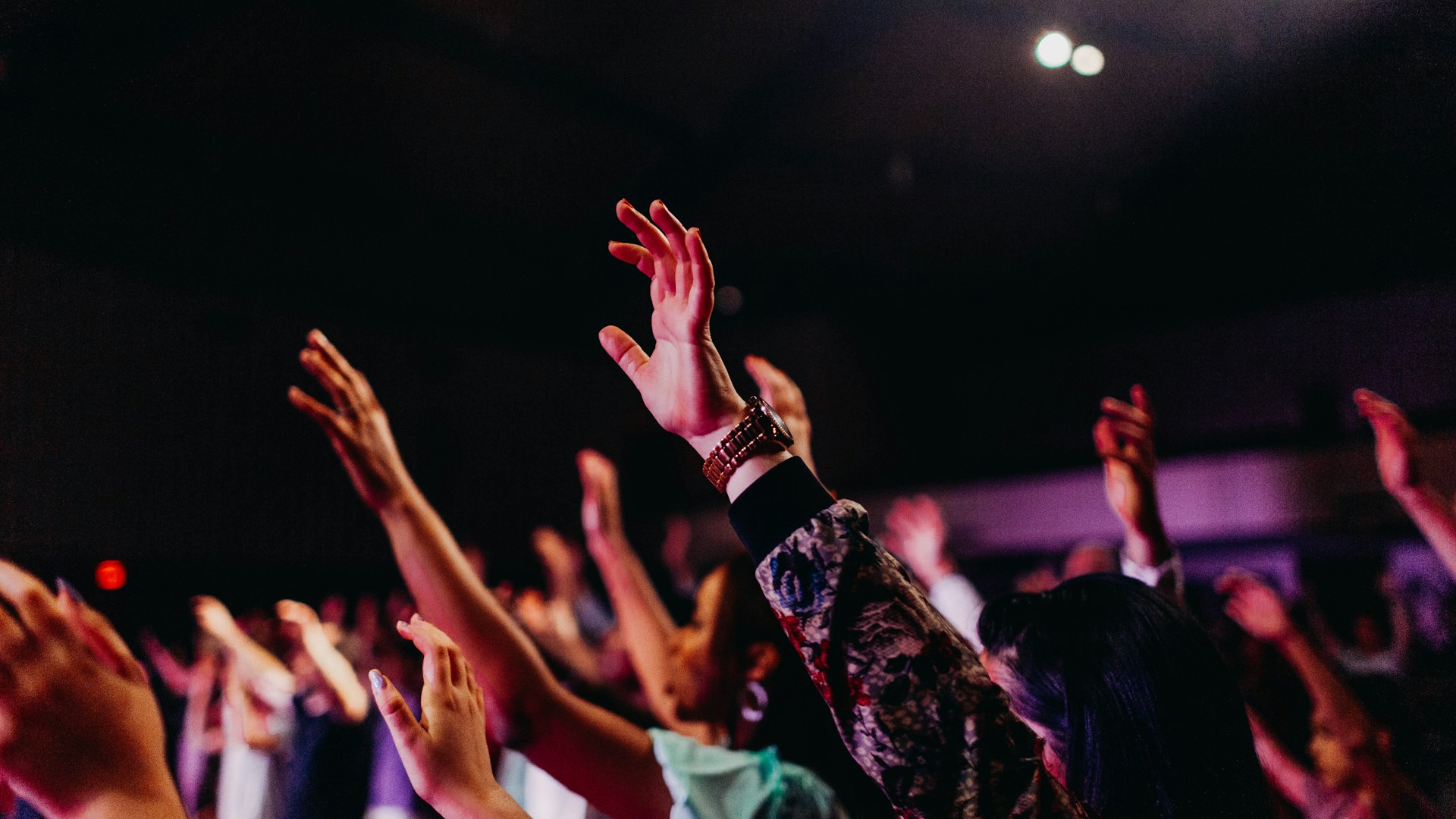 Church congregation worship with raised hands