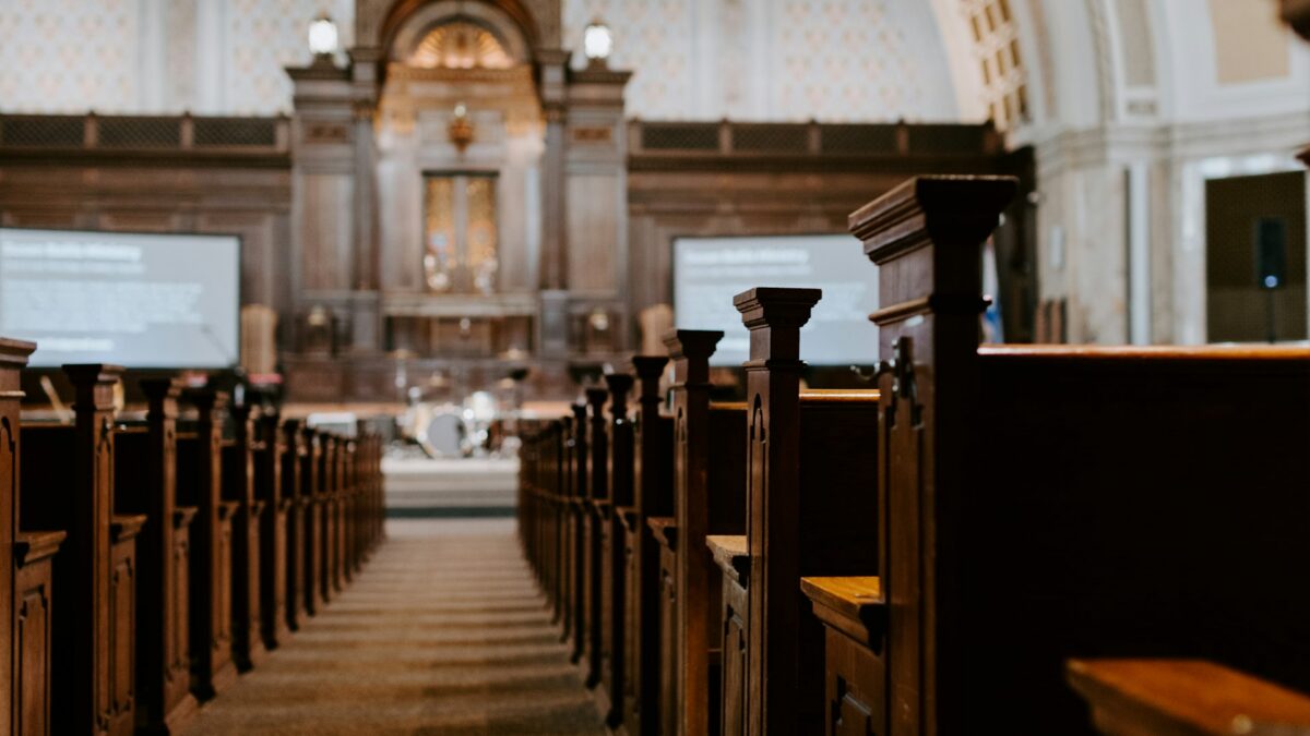 Church sanctuary interior with pews