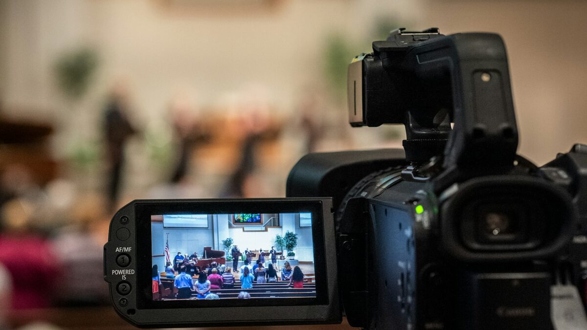 Video camera filming a church service
