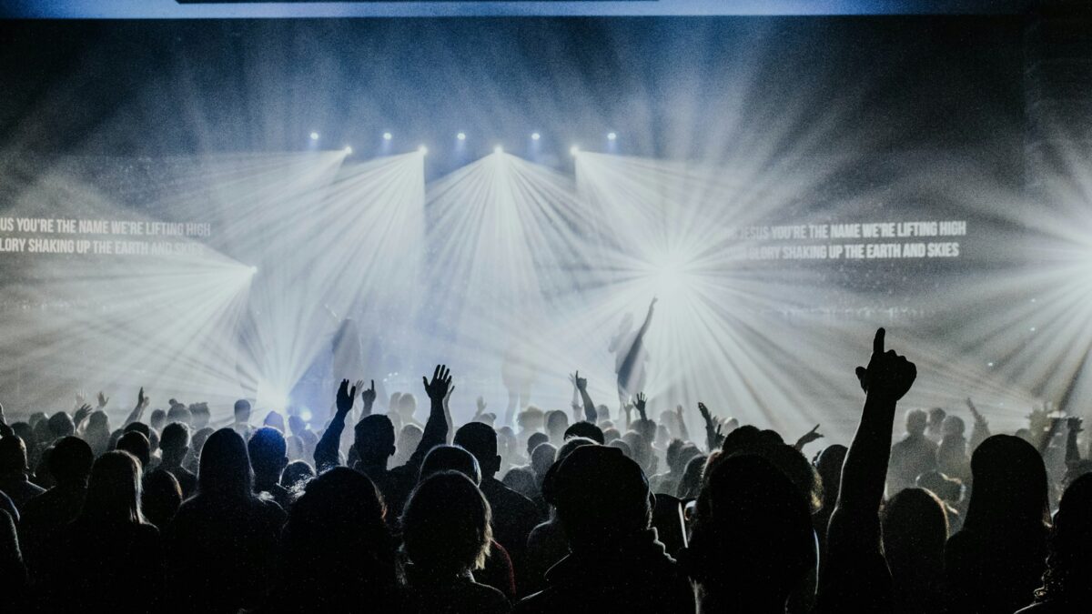 Worship crowd with stage lighting at church service