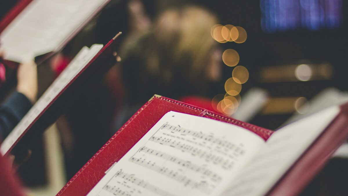 Church choir singing with hymnals