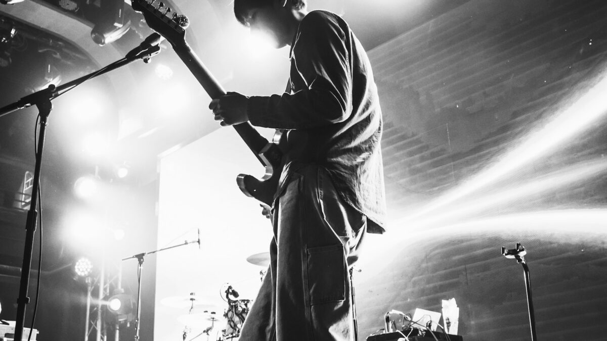 Musician on worship stage with in-ear monitors