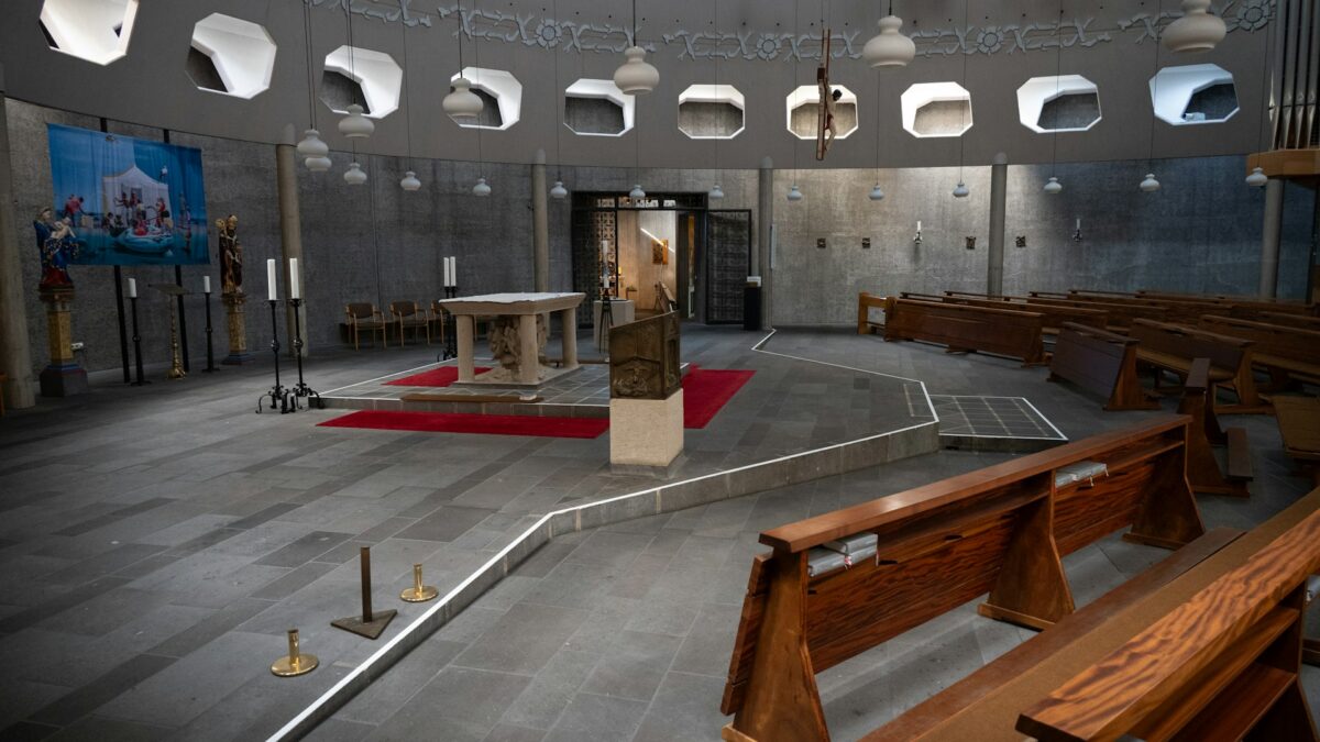 Modern church interior sanctuary with pews