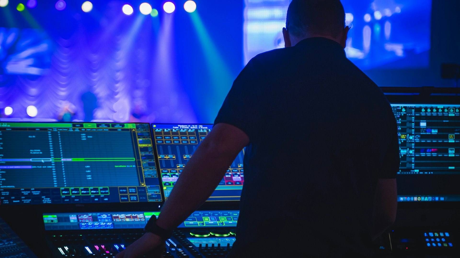 Volunteer operating an audio mixer at a live event