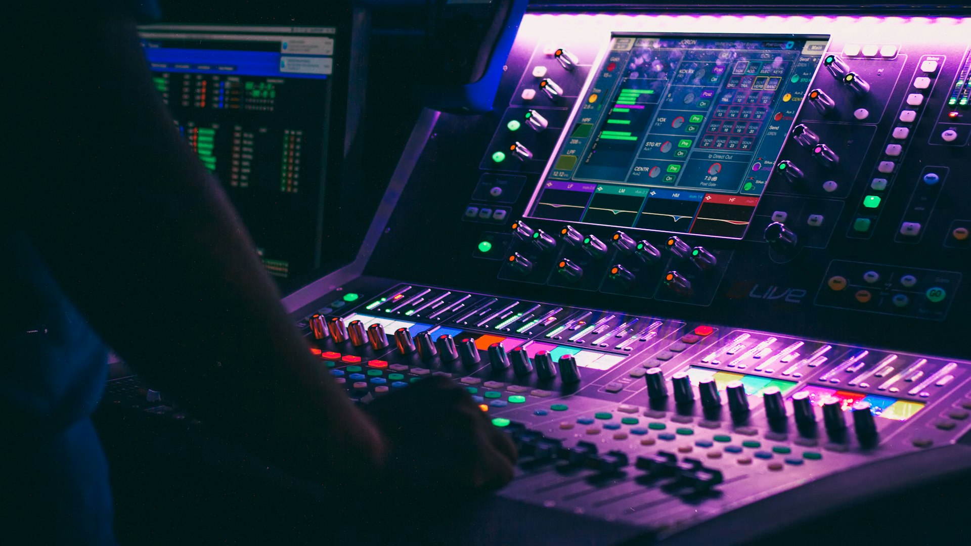 Person operating an audio mixing console