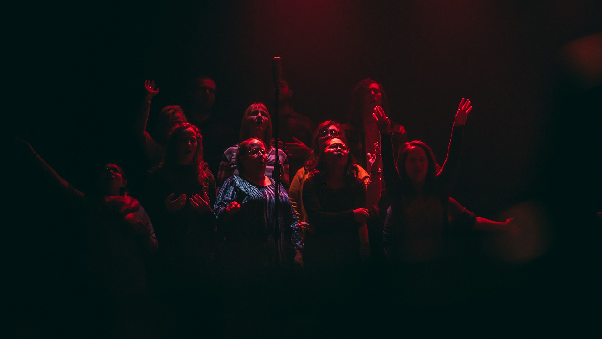 Worship team singing on stage