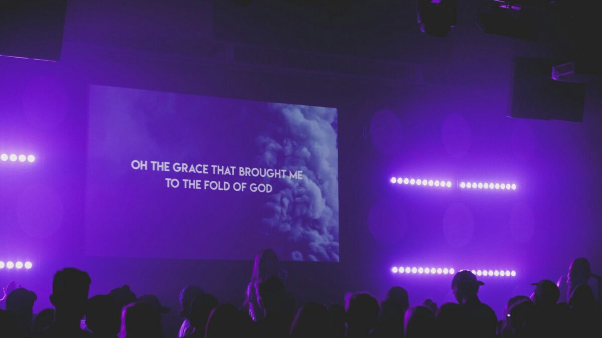Worship lyrics on a church presentation screen